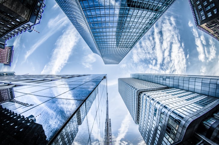 low-angle-photo-of-four-high-rise-curtain-wall-buildings-830891