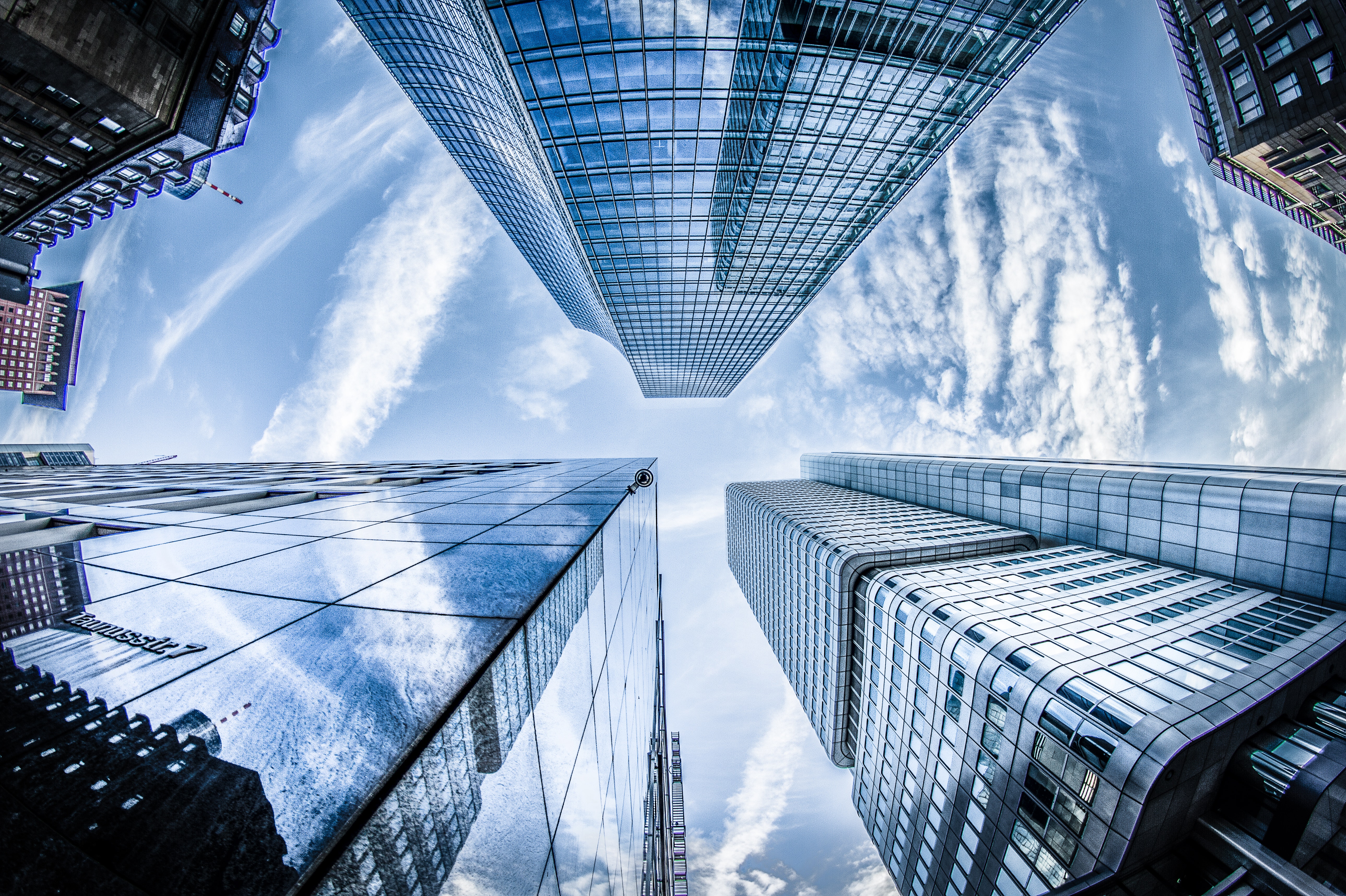 low-angle-photo-of-four-high-rise-curtain-wall-buildings-830891